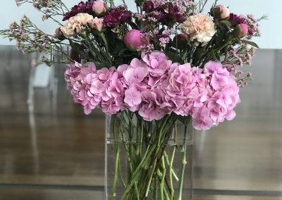 Stunning tall vase of flowers by Petal and Rose