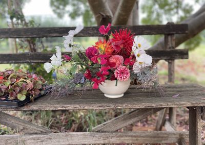 asymmetrical flowers in ceramic bowl by Petal and Rose