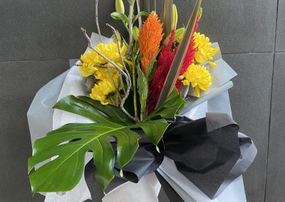 Flowers arranged with winter twig by Petal and Rose